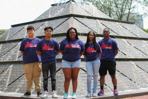Five Upward Bound students stand in front of the pyramid fountain on the IUPUI campus.