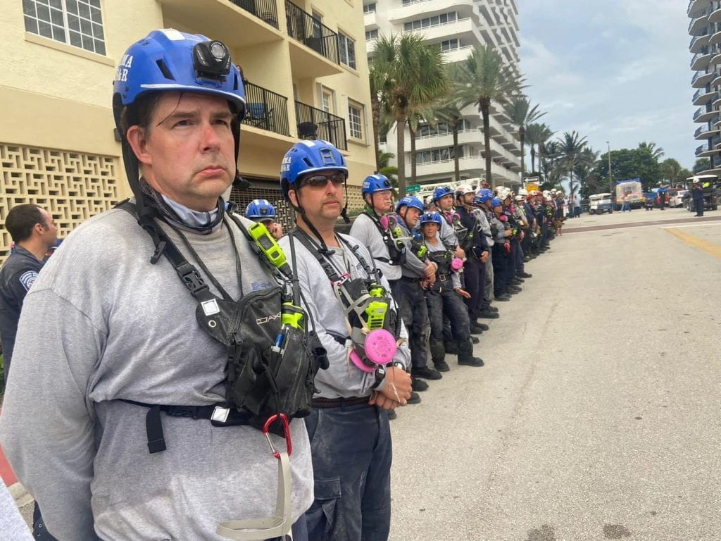 Dr. Strachan stands in a long line of rescuers in equipment in Florida.