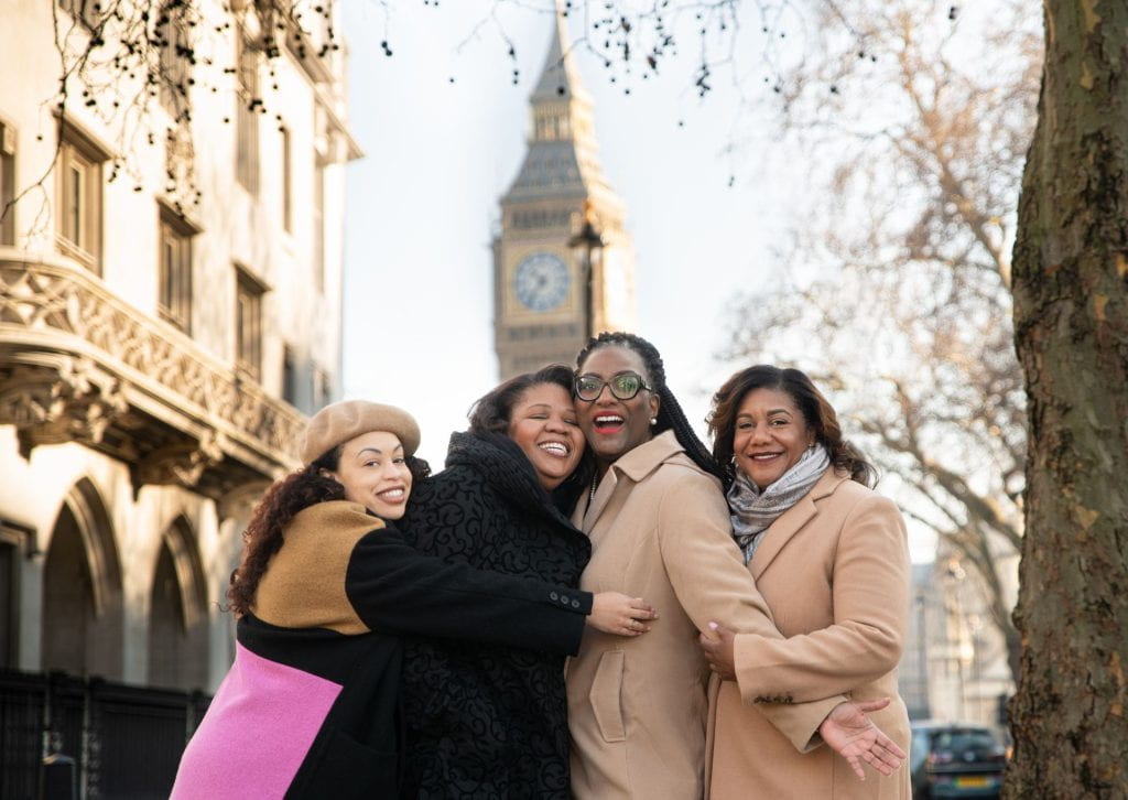 Image of Dr. Adair and three other women posing in front of Big Ben in London.